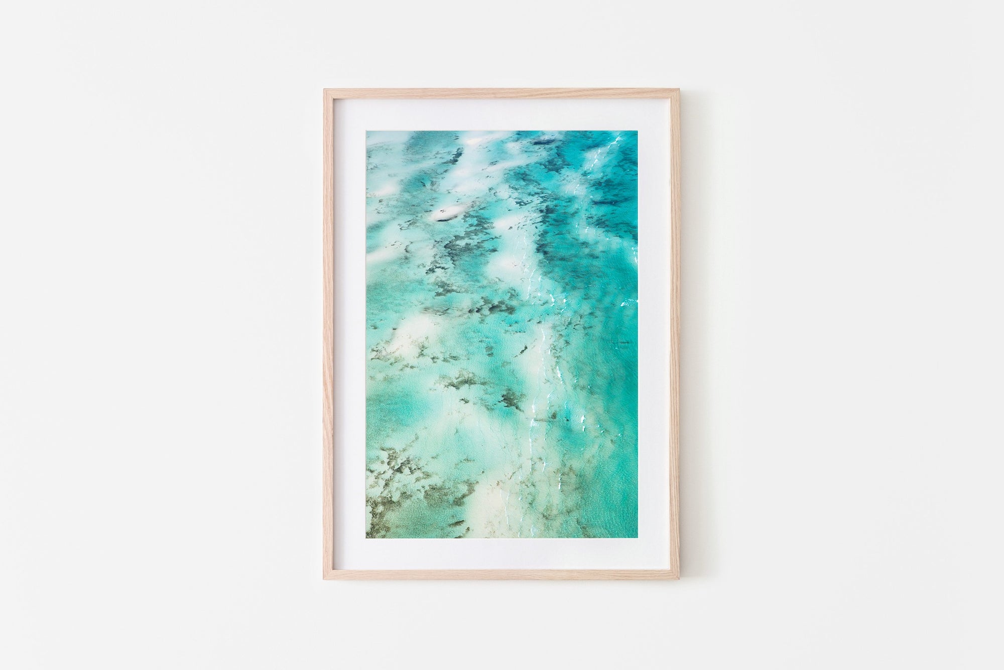 Abstract beach print framed in an oak frame
