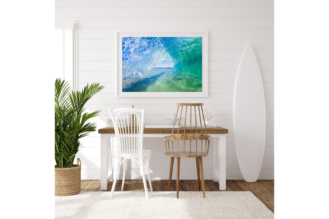 Inside the Green Room wave print framed in white, hung in a coastal styled room with a surfboard and shiplap wall