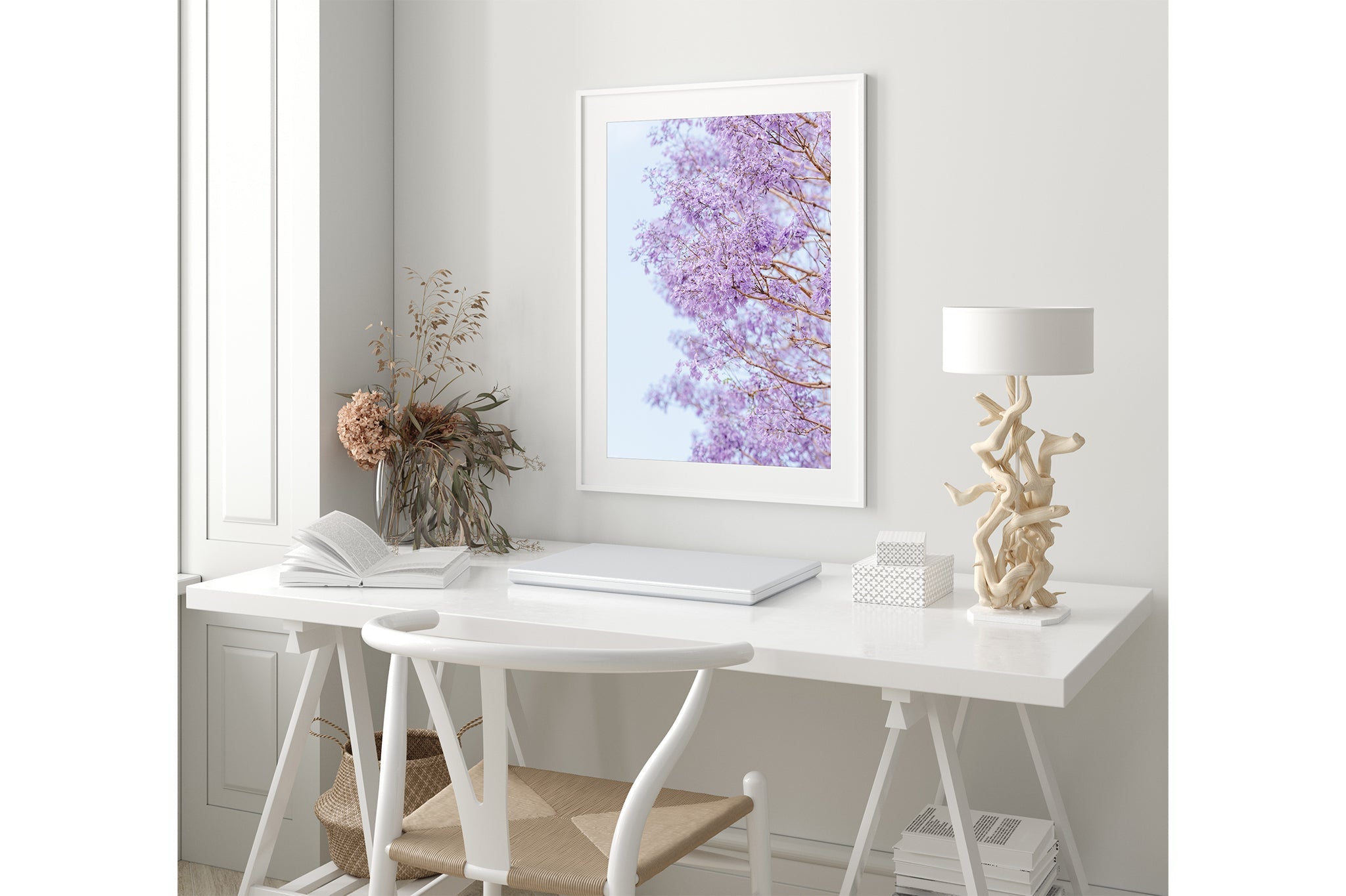 The Jacaranda Veil print shown framed in white in a coastal-styled room.