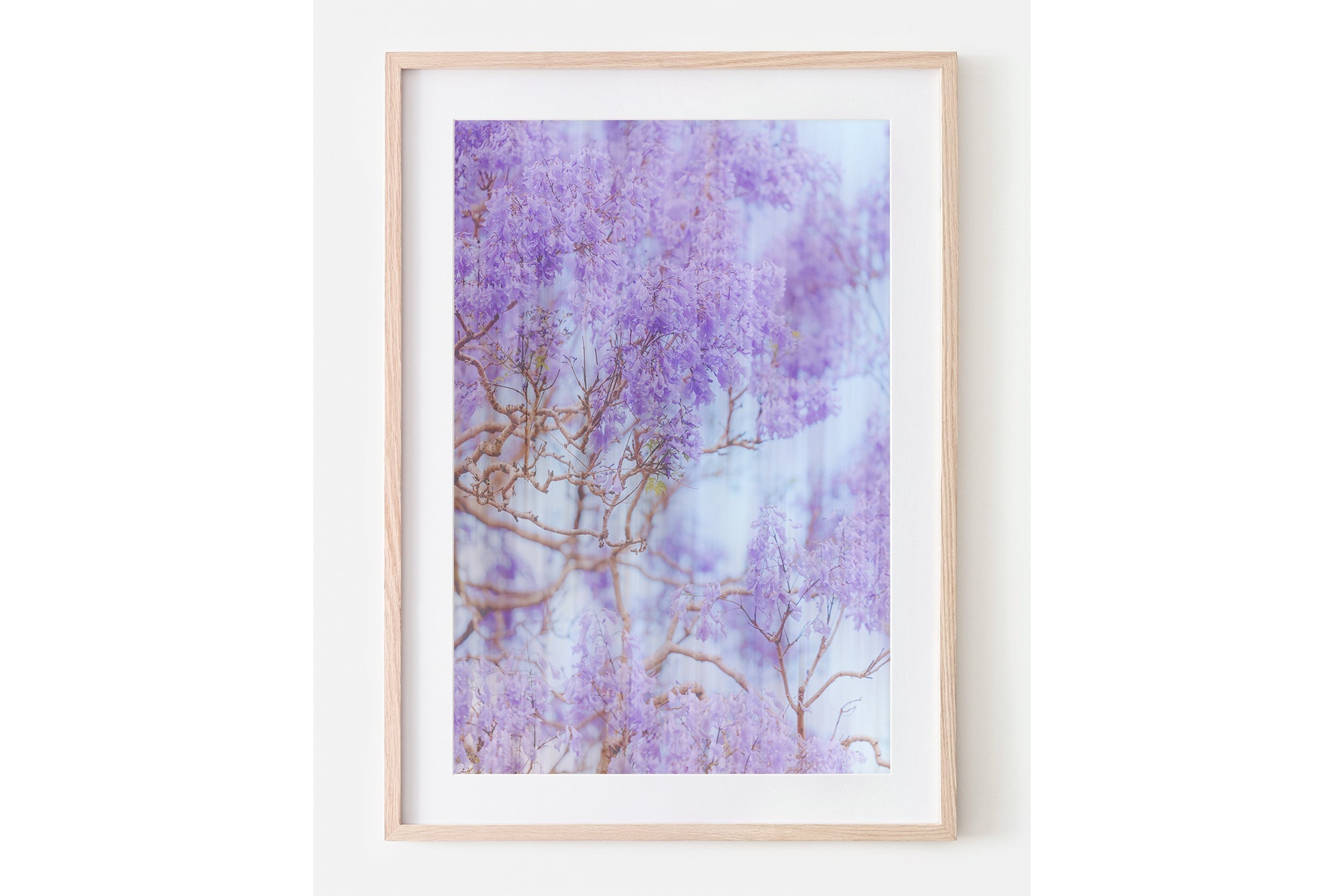 The Lavender Dream print shown framed in oak.
