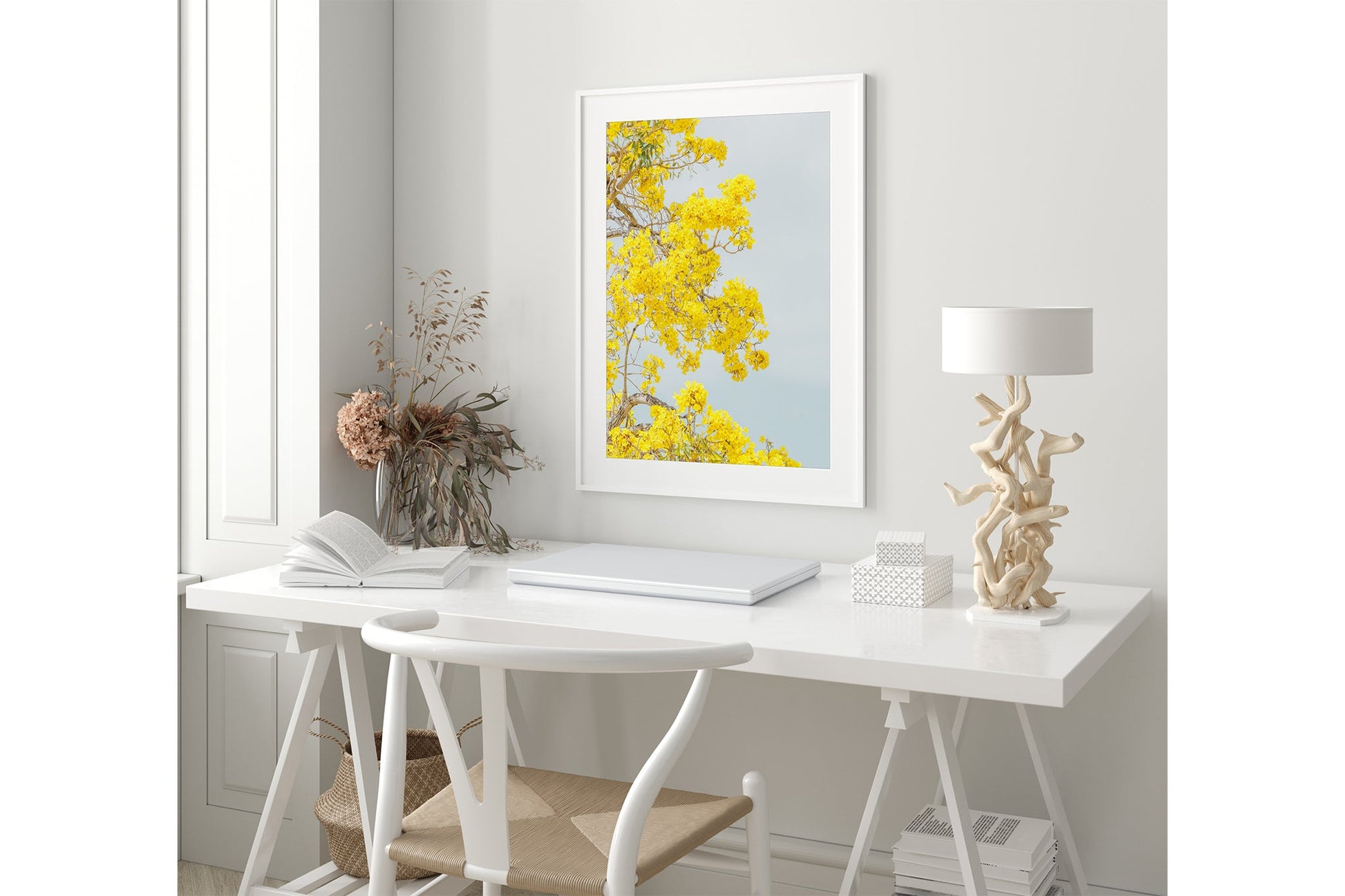 The Golden Trumpet print shown framed in white in a coastal-styled room.