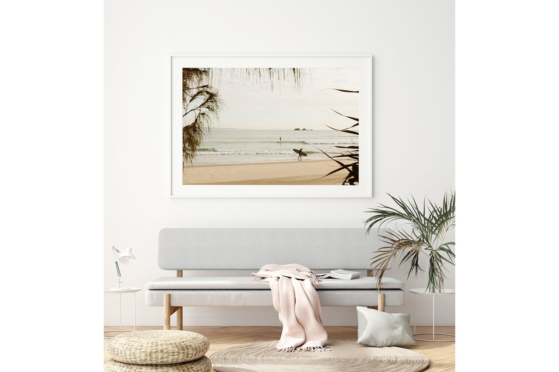 Byron Bay pastel surf print shown framed in white above a bench seat.