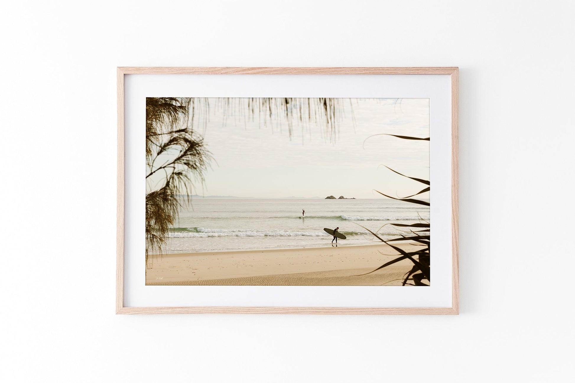 Byron Bay pastel surf print shown framed in oak.