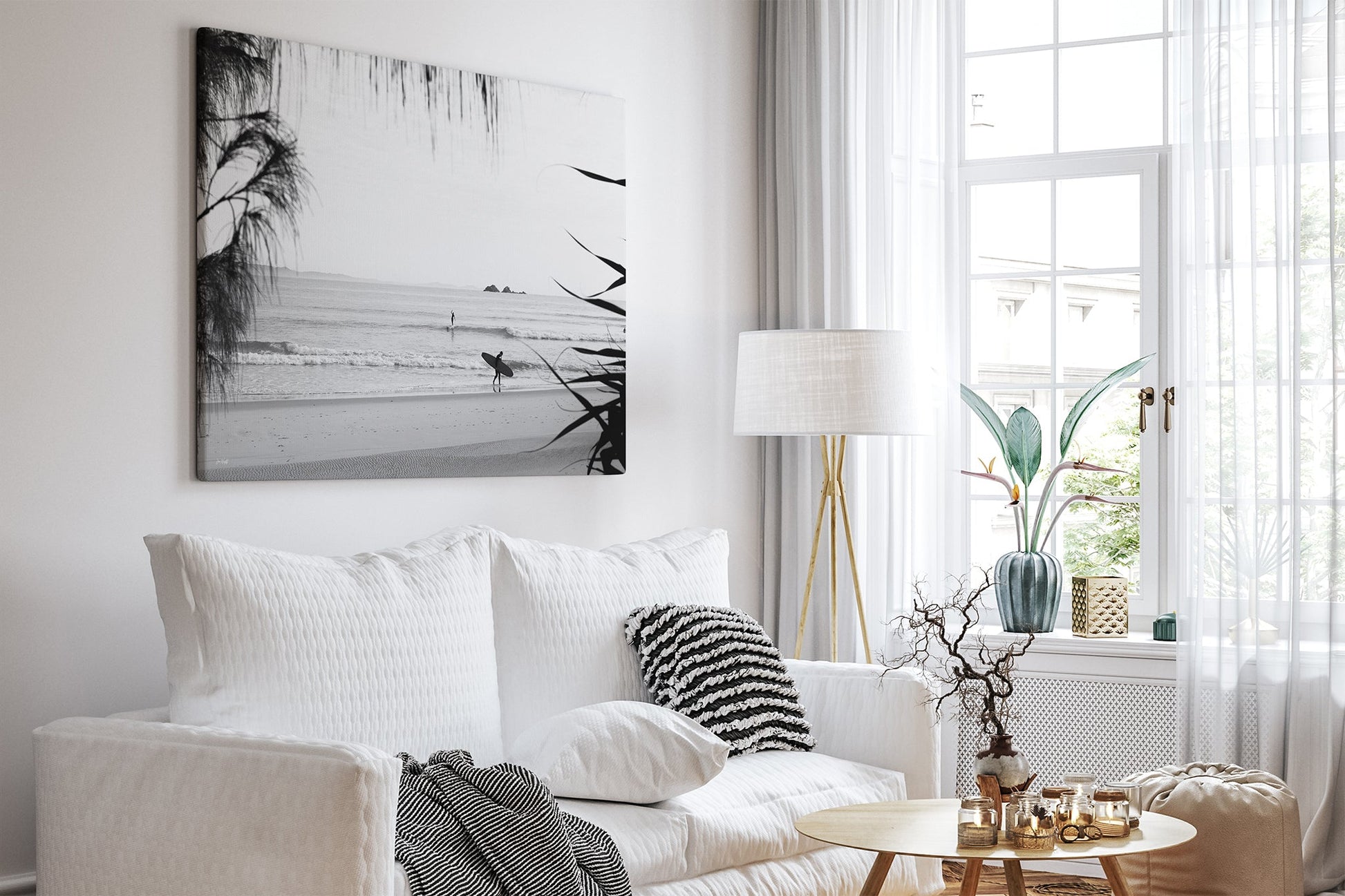Byron Bay black and white surf print shown as a canvas in a white room.