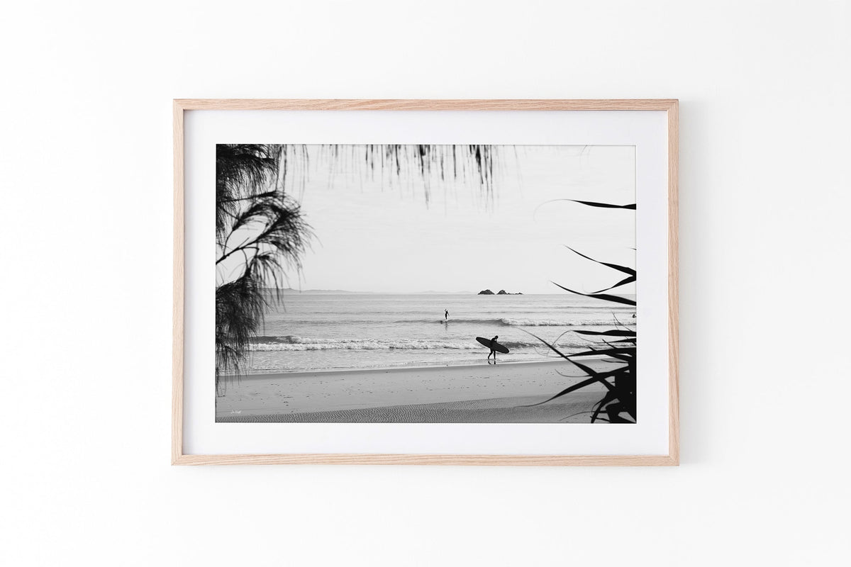 Byron Bay black and white surf print shown framed in oak.