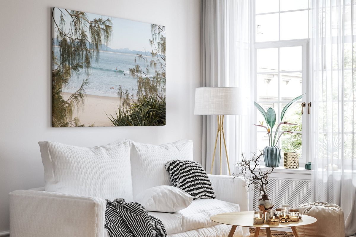 Byron Bay coastal print shown as a canvas in a white room.