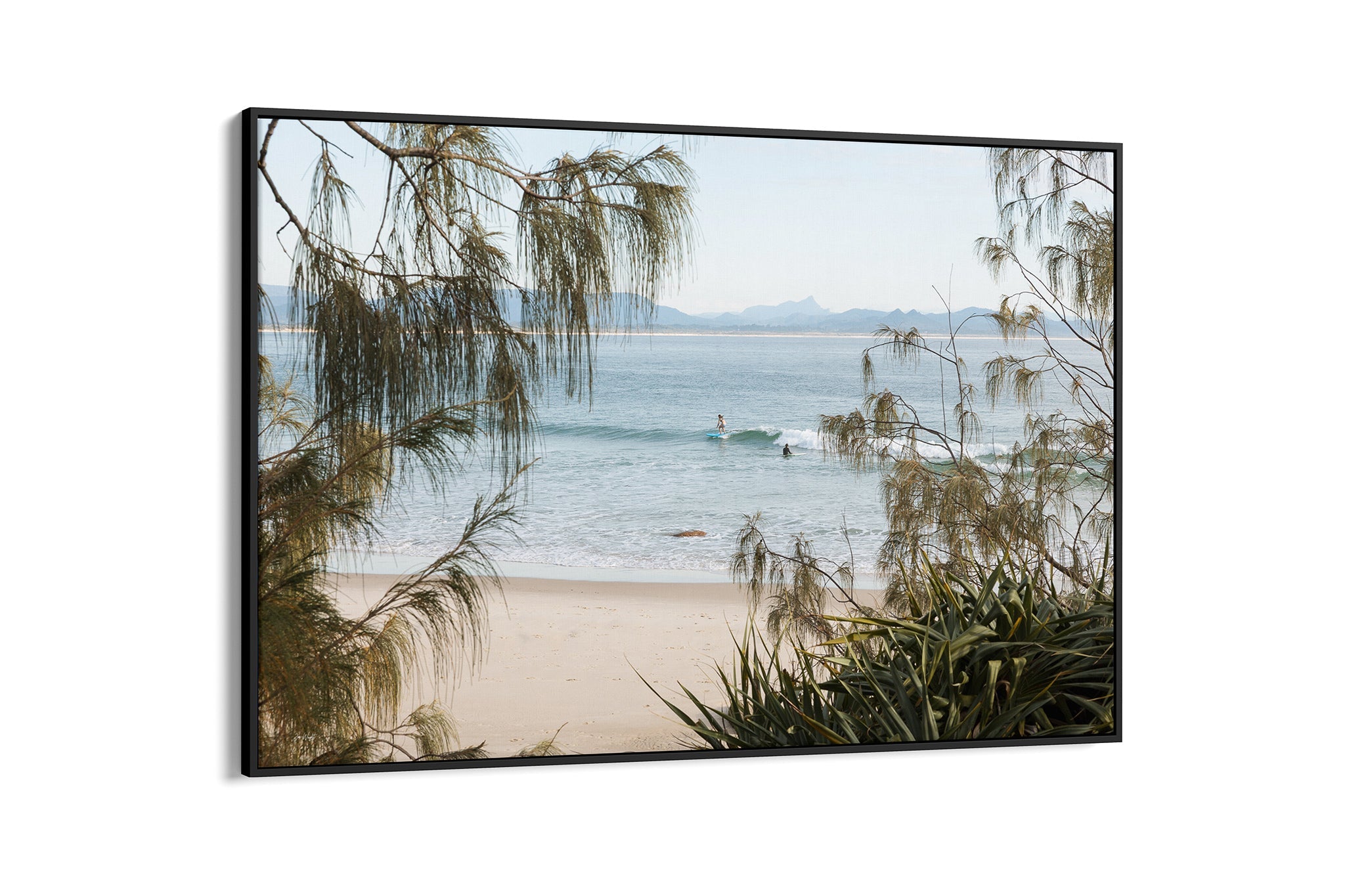 Byron Bay coastal print shown as a black float frame canvas.