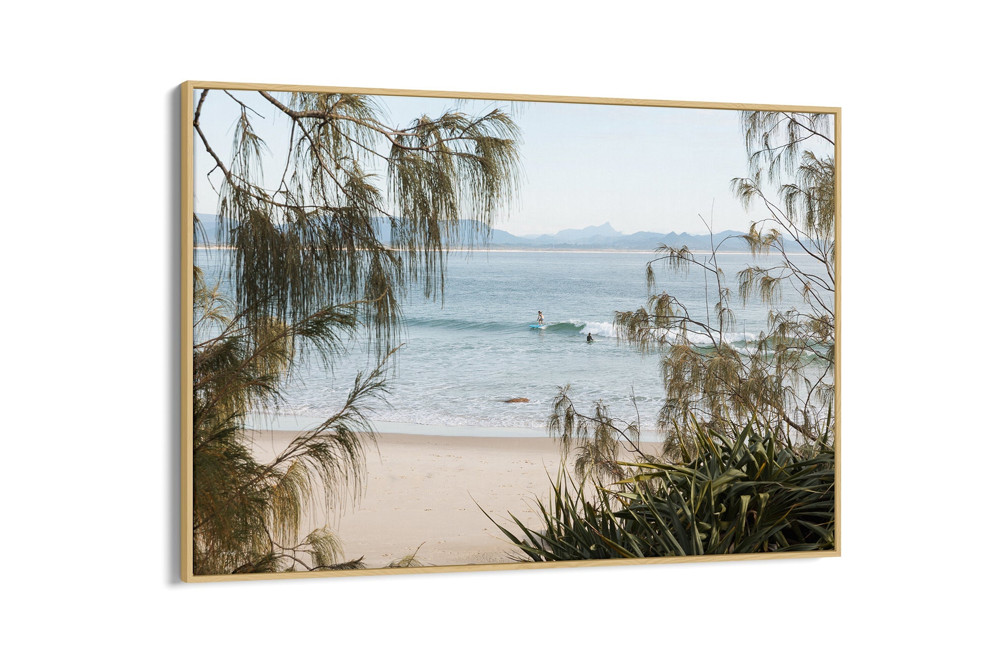 Byron Bay coastal print shown as an oak float frame canvas.