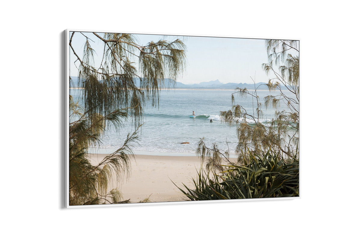 Byron Bay coastal print shown as a white float frame canvas.
