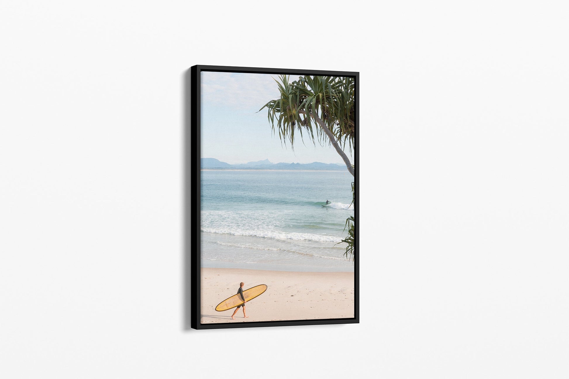 Yellow longboard Byron Bay print shown as a black float frame canvas.