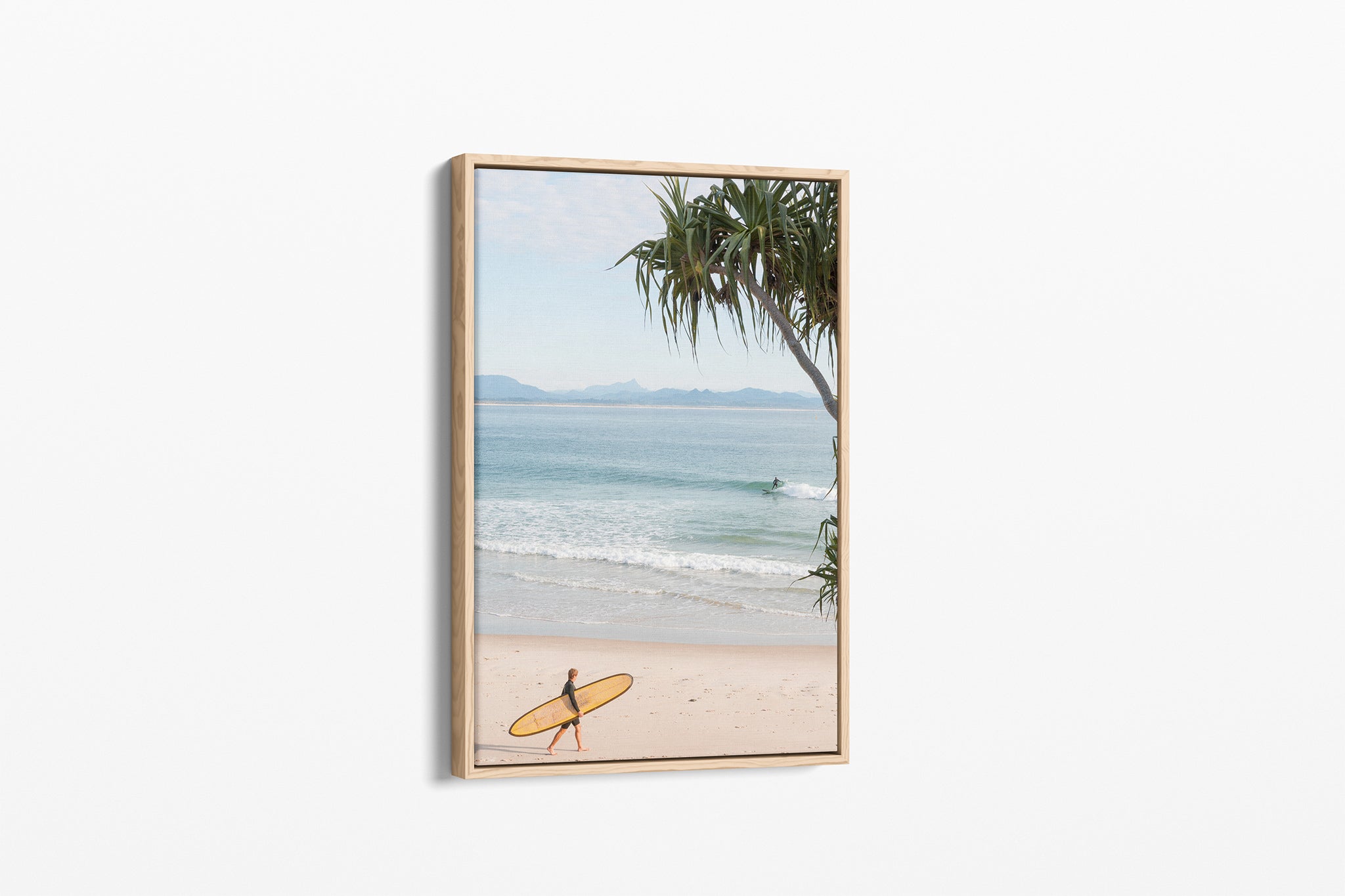 Yellow longboard Byron Bay print shown as an oak float frame canvas.