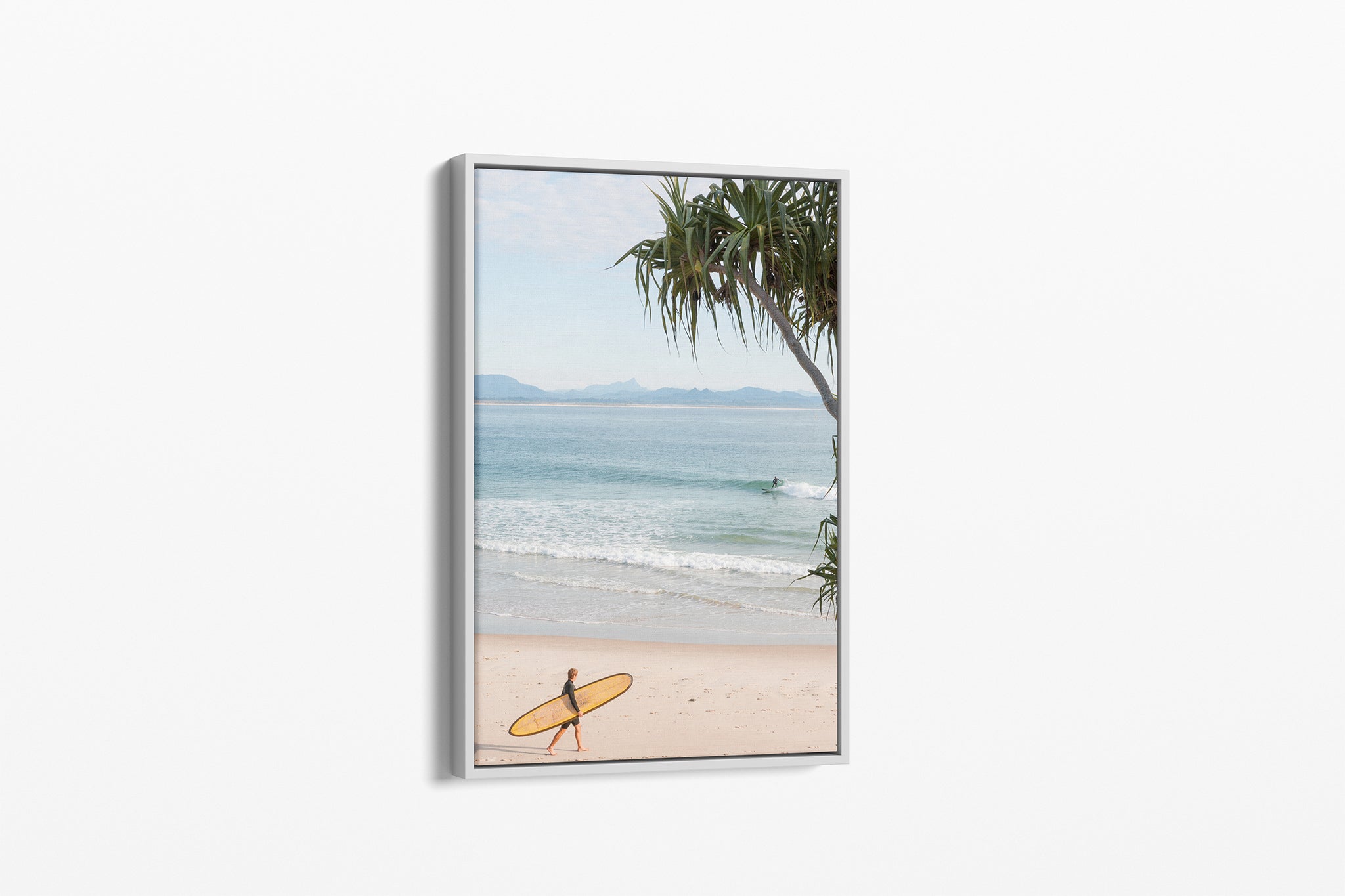 Yellow longboard Byron Bay print shown as a white float frame canvas.