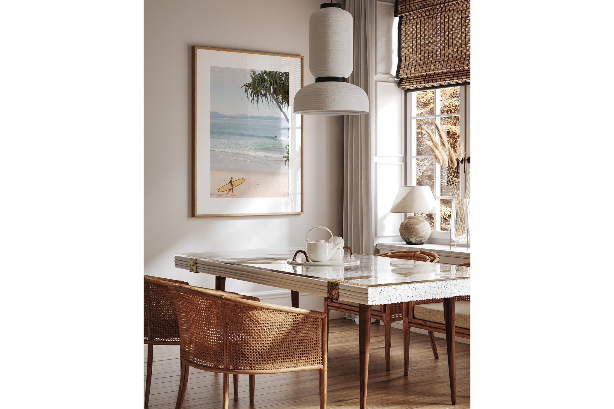Yellow longboard Byron Bay print shown framed in oak above a dining table.