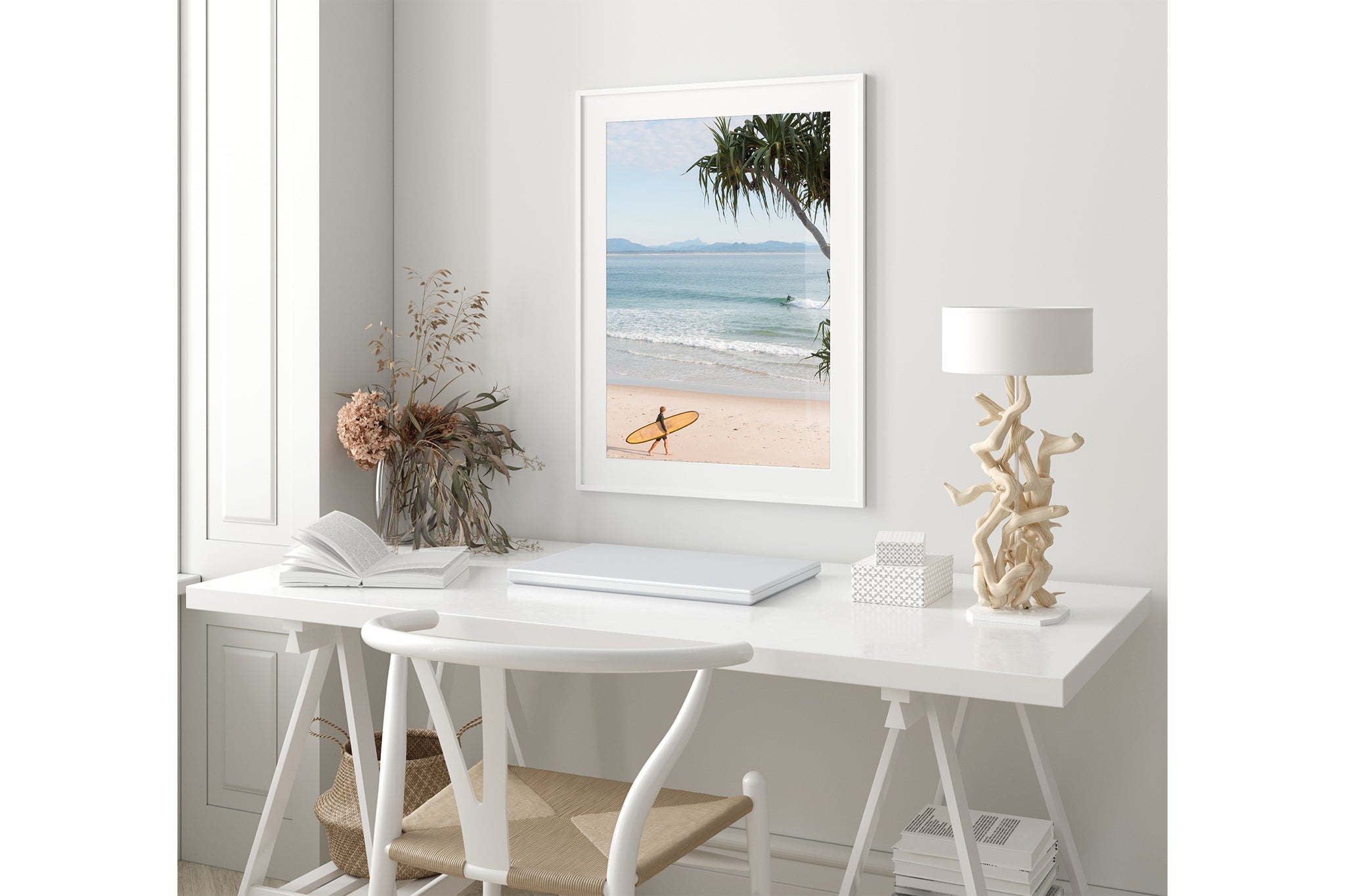 Yellow longboard Byron Bay print shown framed in white in a coastal styled room.