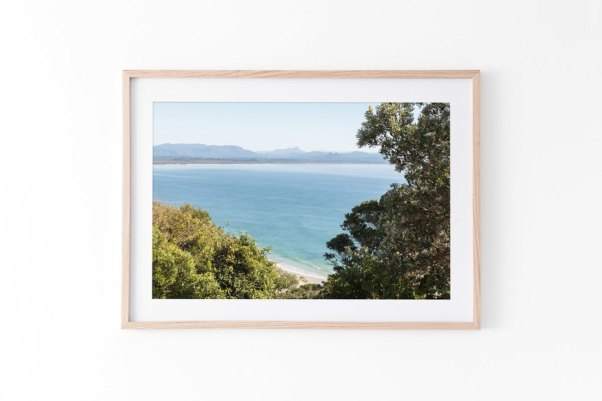Byron Bay lookout print shown framed in oak.