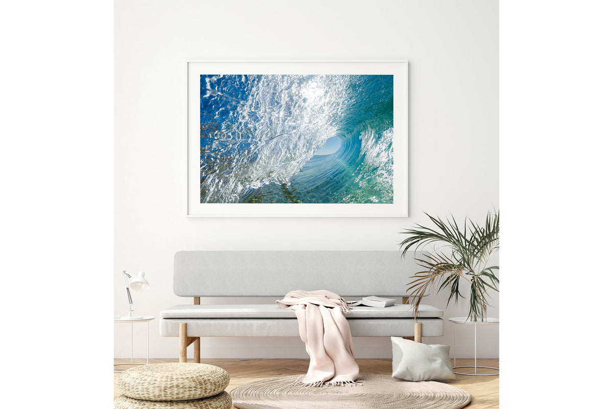 Glass Tunnel print shown framed in white above a bench seat.