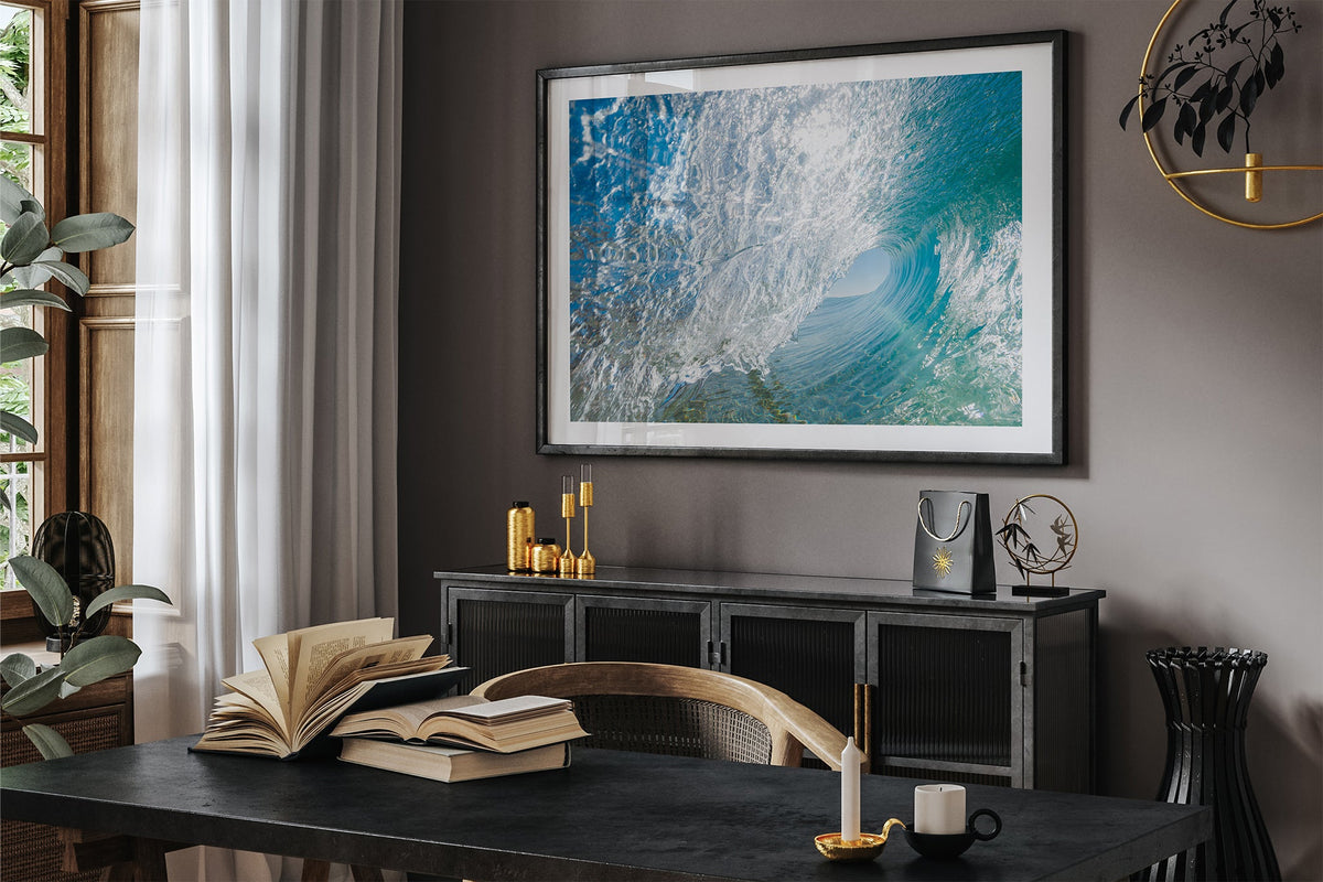 Glass Tunnel print shown framed in black in a dark room.