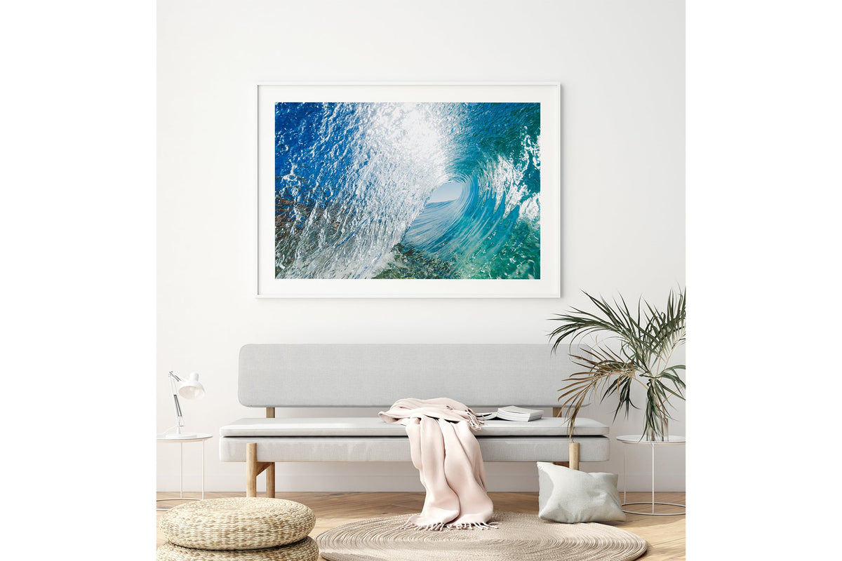 Blue Chamber print shown framed in white above a bench seat.