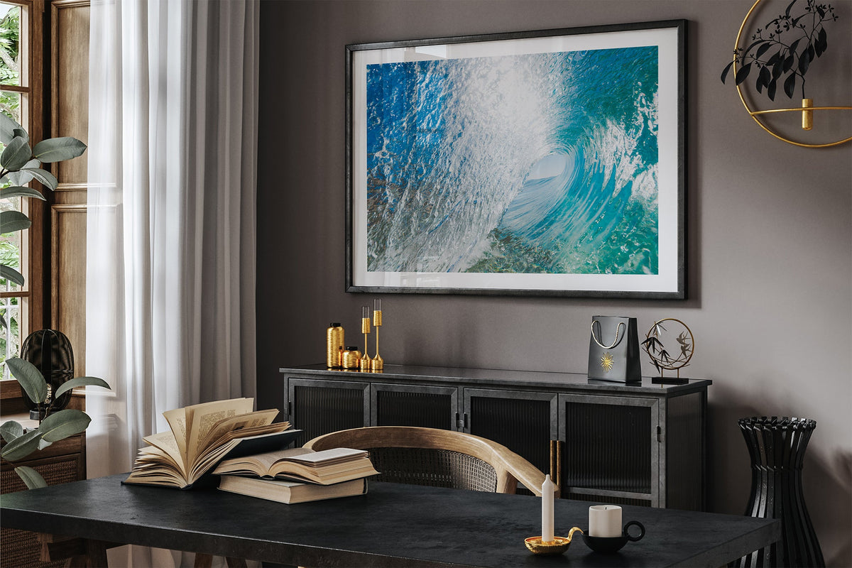 Blue Chamber print shown framed in black in a dark room.