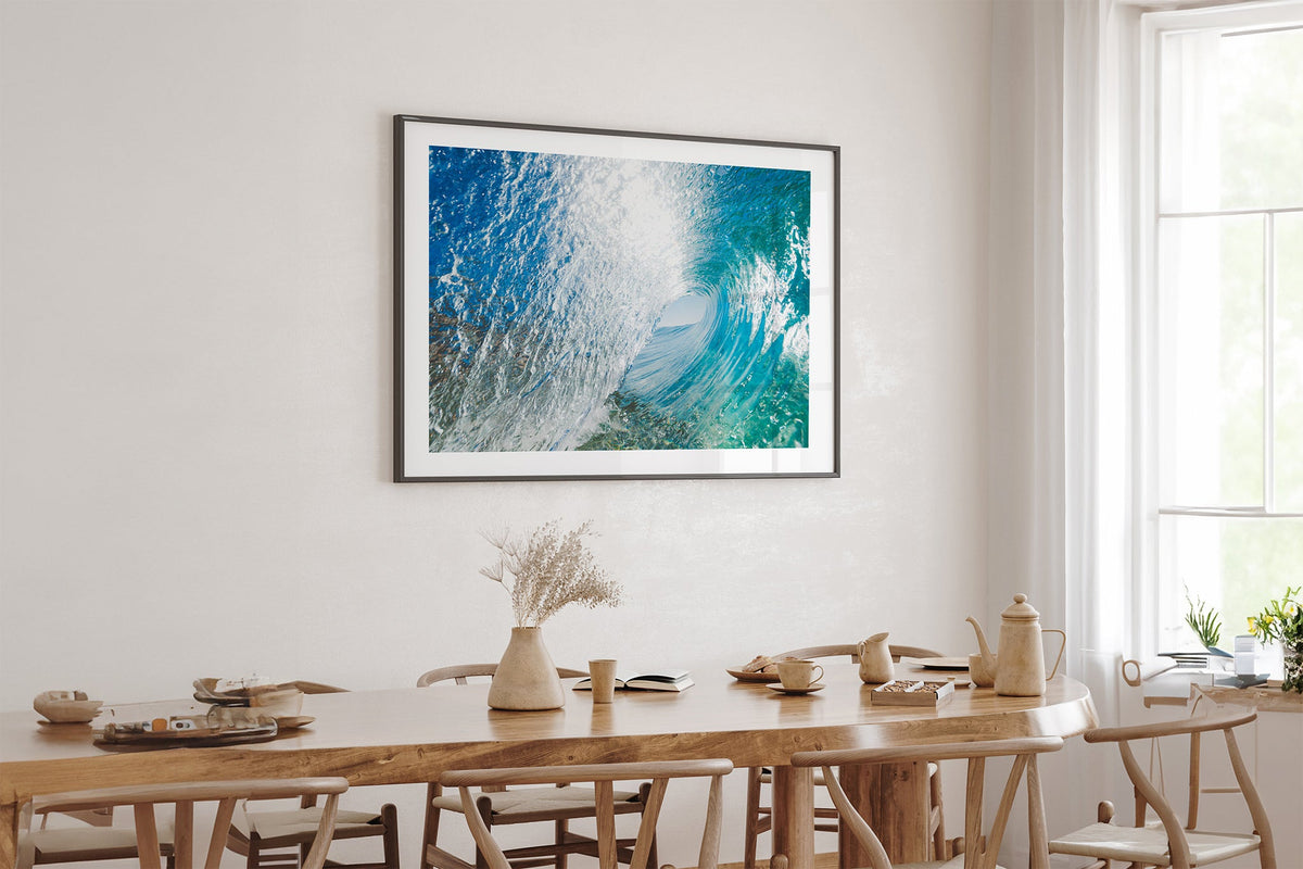 Blue Chamber print shown framed in black above an oak table.