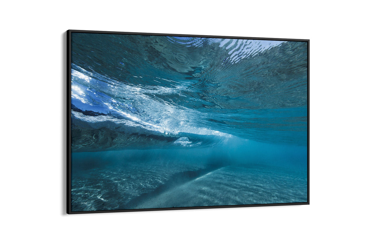 Quiet Shallows print shown as a canvas in a black float frame.