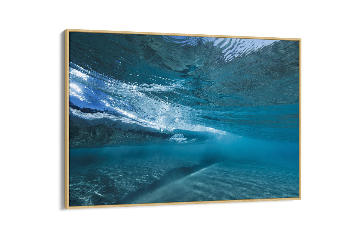 Quiet Shallows print shown as a canvas in an oak float frame.
