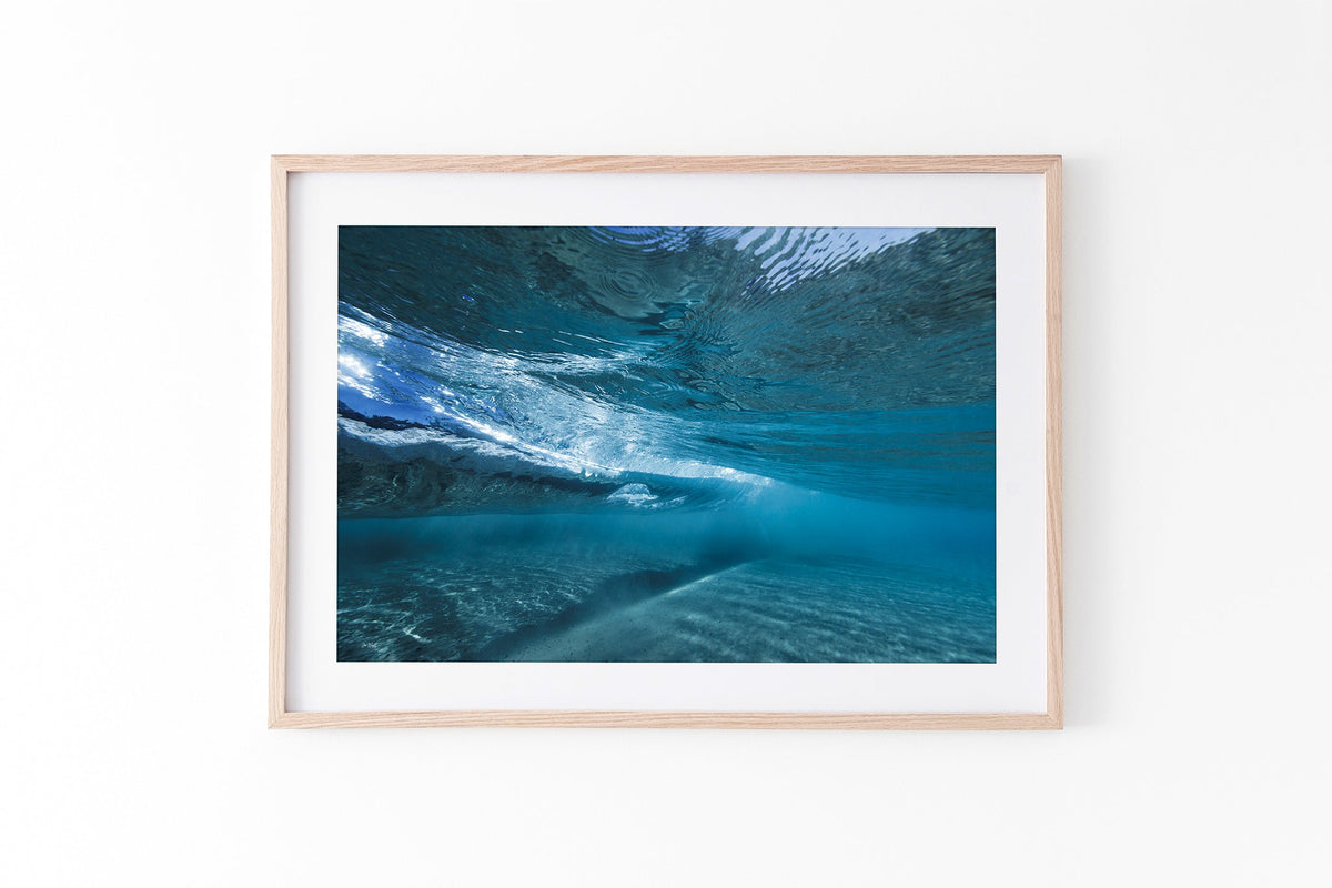 Quiet Shallows print shown framed in oak.