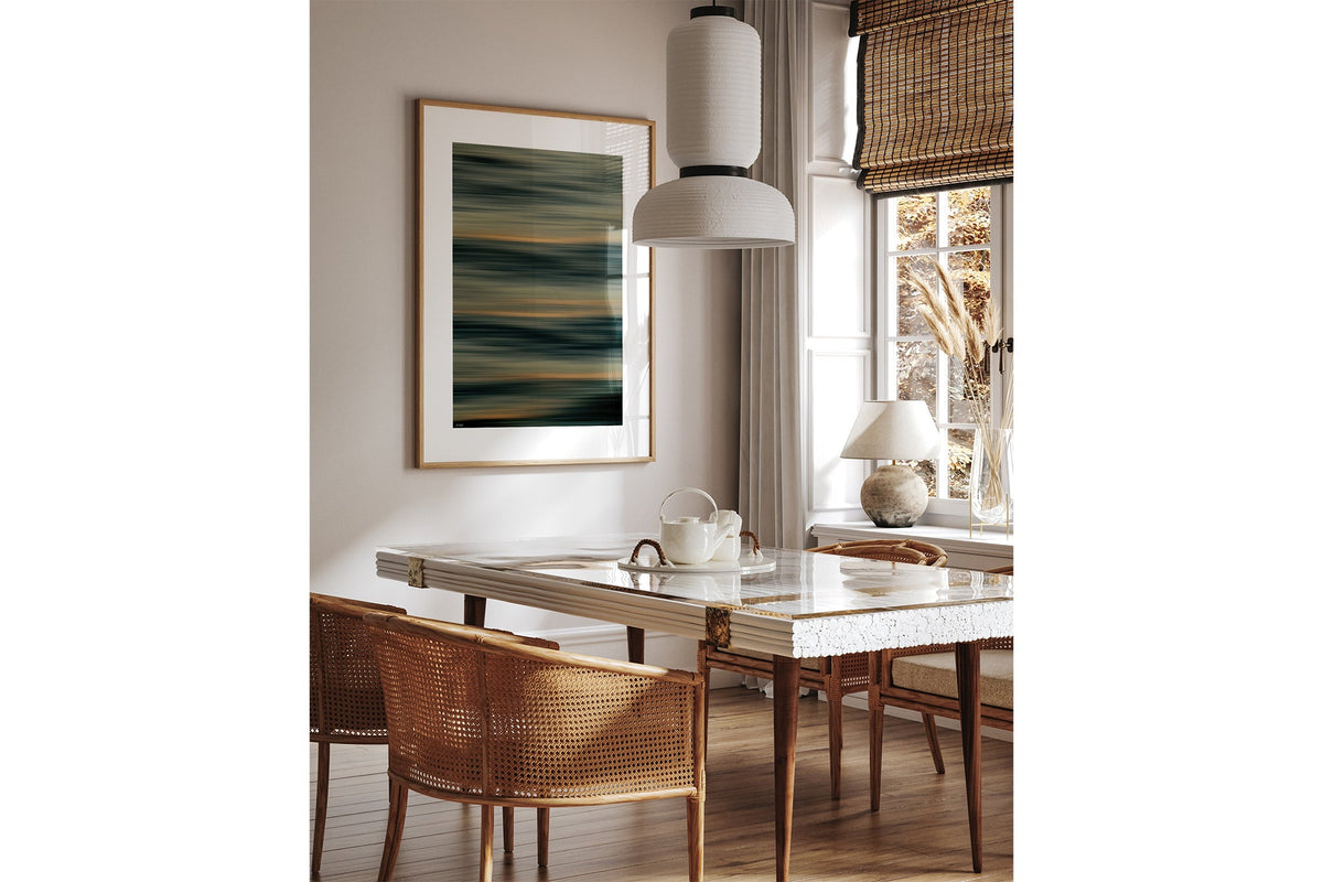 Amber Lines print shown framed in oak above a dining table.