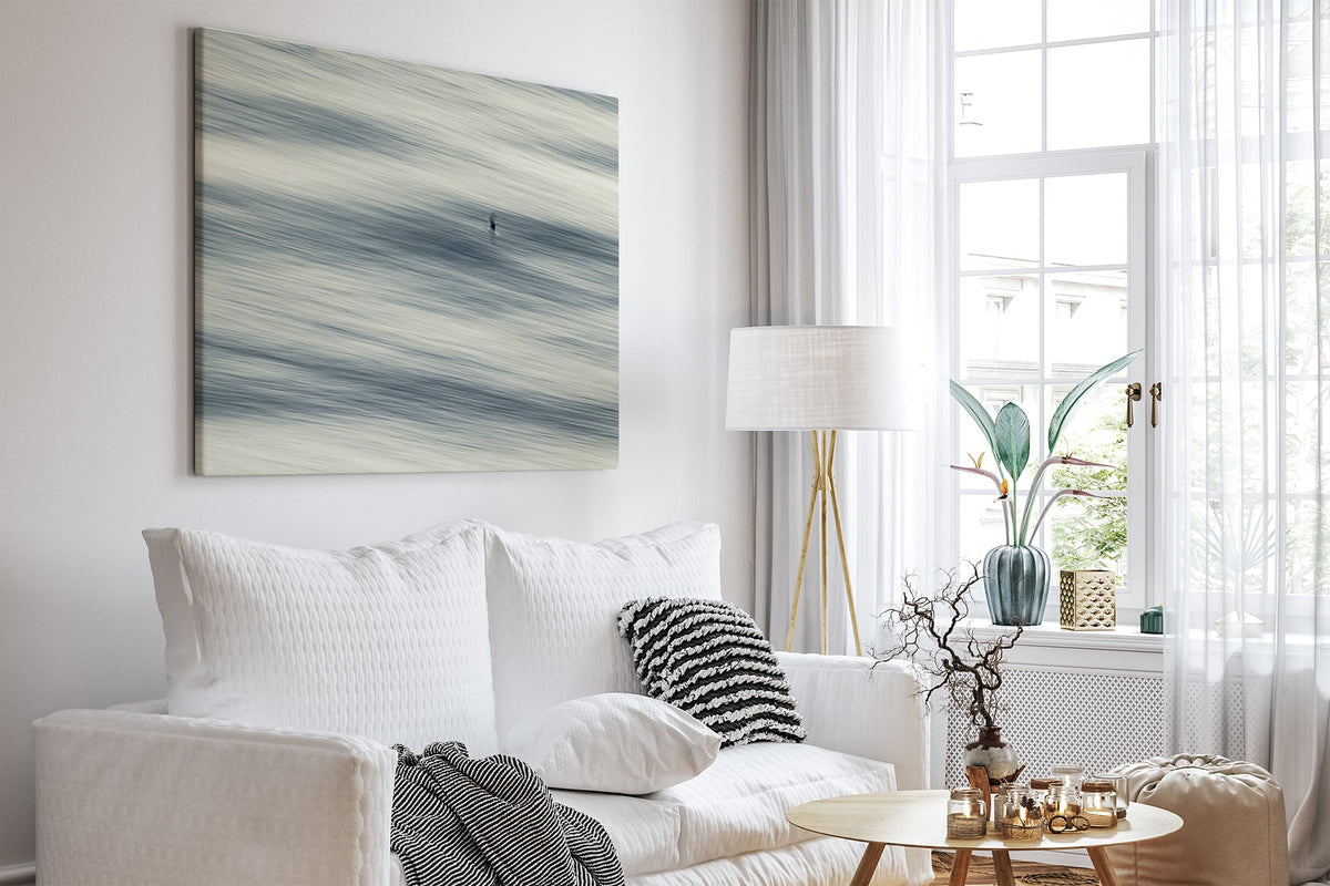 Lone Gull print shown as a canvas print in a white room.