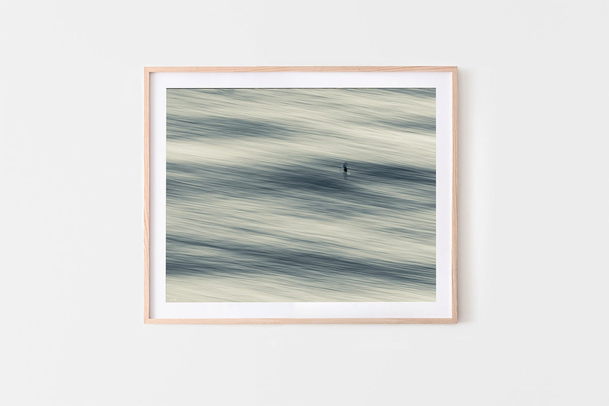 Lone Gull print shown framed in oak.
