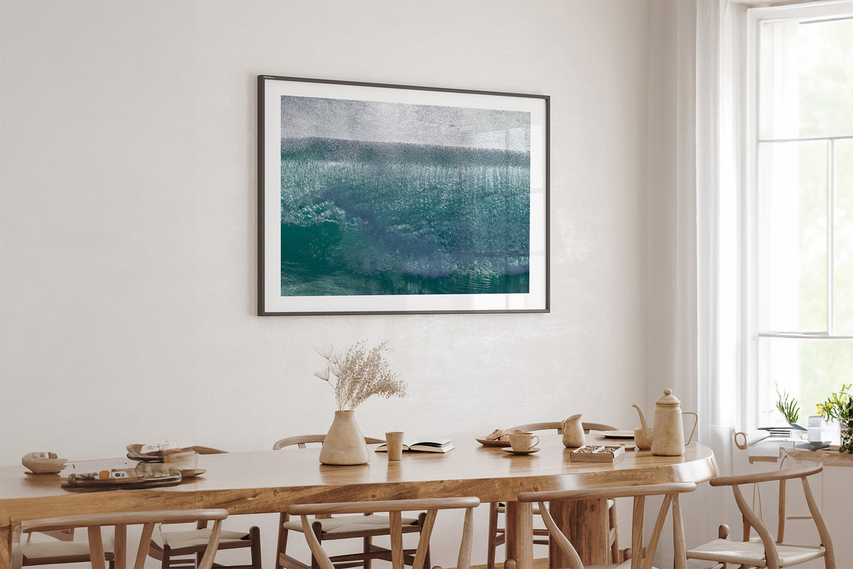 Jade Veil print shown framed in black above an oak table.