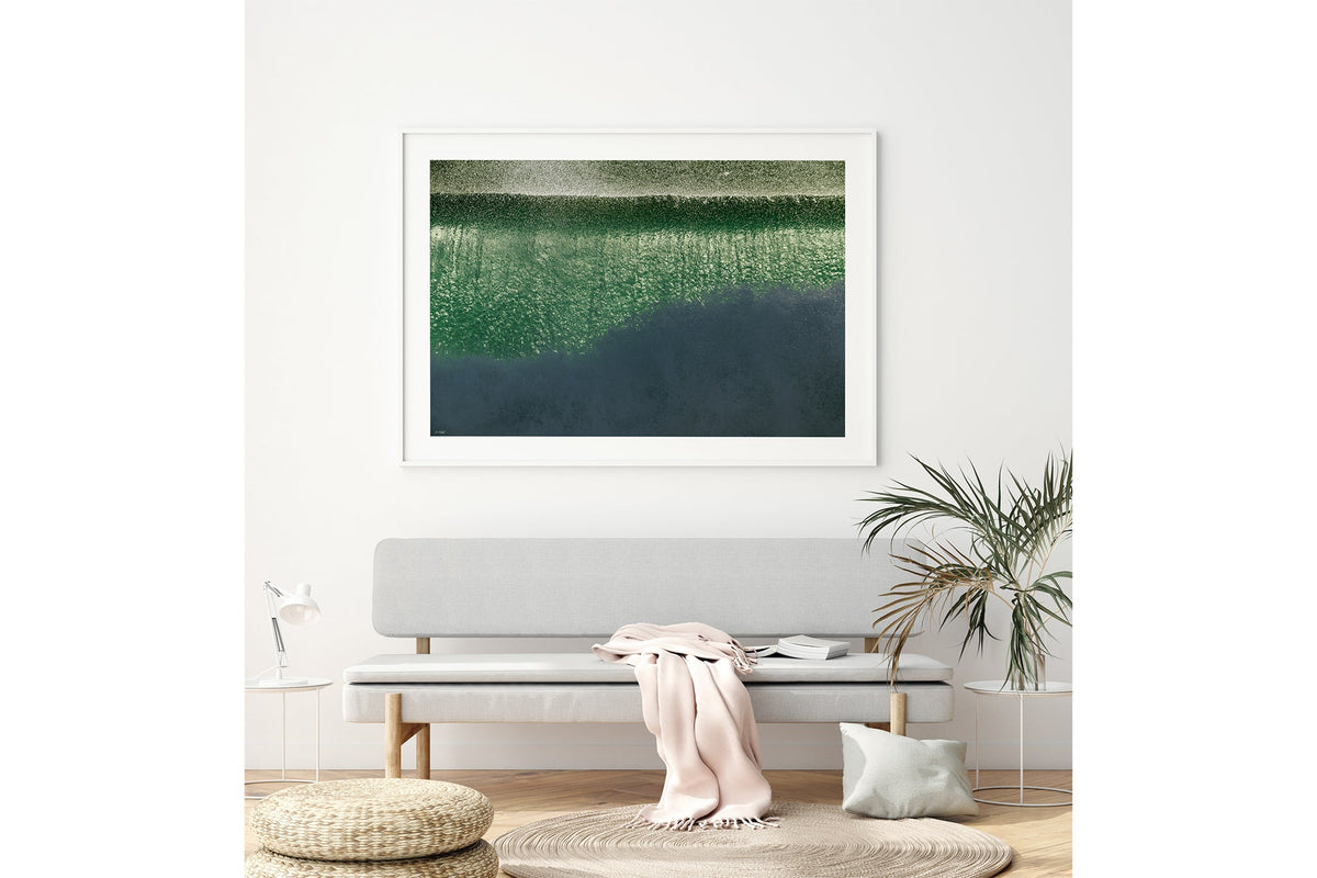 Green Cascade print shown framed in white above a bench seat.
