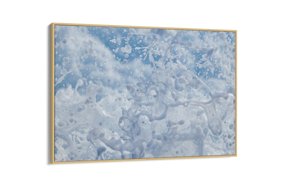 Frozen Splash print shown as a canvas in an oak float frame.