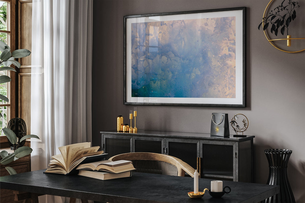 Coral Marble print shown framed in black in a dark room.