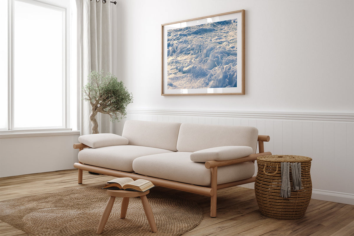 Frost Foam print shown framed in oak above a linen couch.
