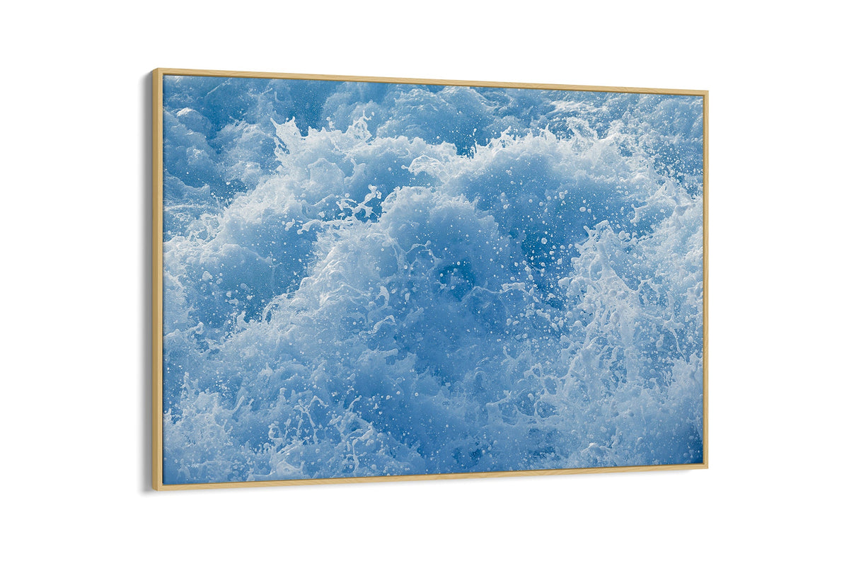 Cobalt Chaos print shown as a canvas in an oak float frame.