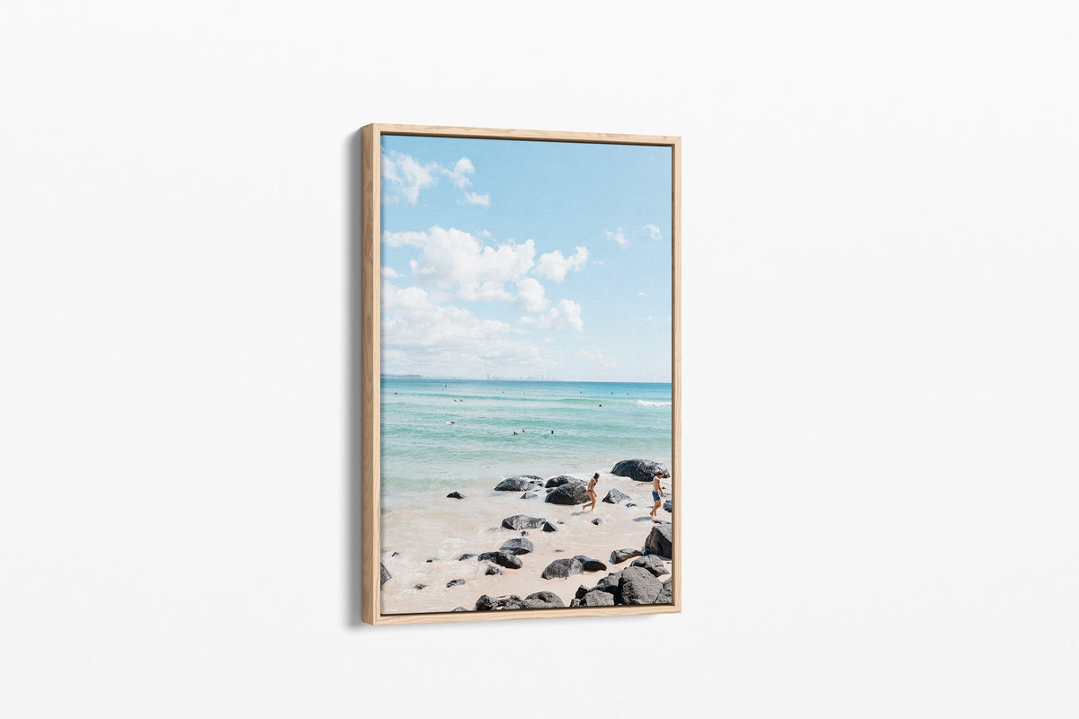 Rocky Shore Skyline print shown as a canvas in an oak float frame.