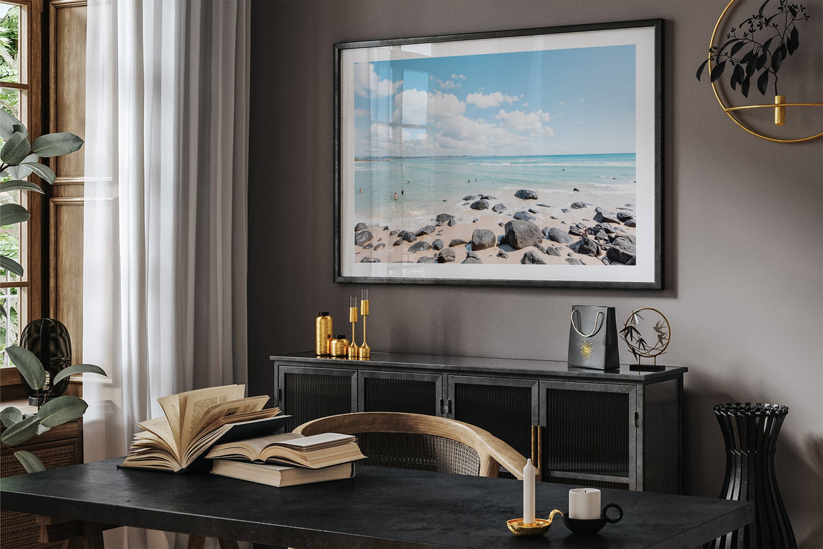 Rock Pool Shallows print shown framed in black in a dark room.