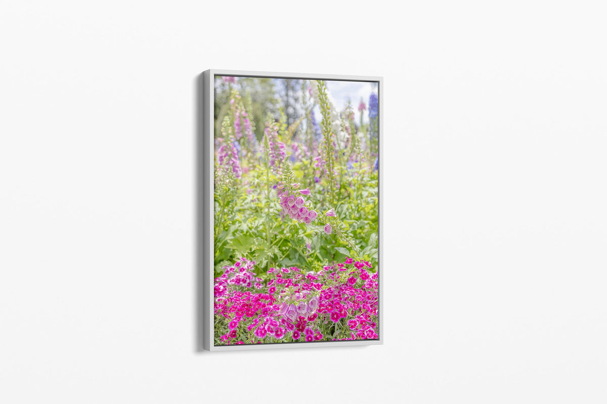 Foxglove garden print shown as a canvas in a white float frame.