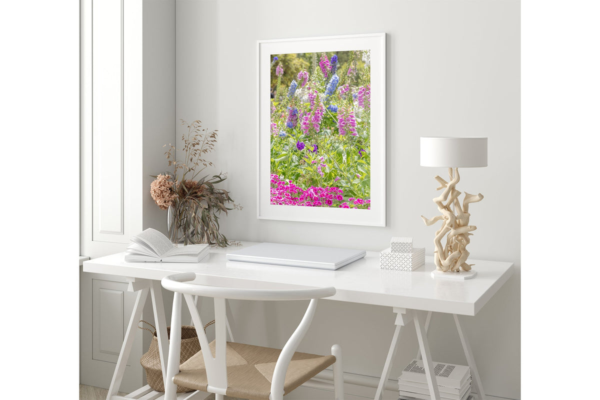 Cottage garden floral print shown framed in white.