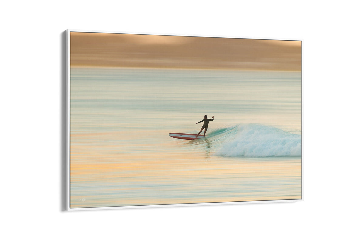 Longboard surfer print shown as a canvas in a white float frame.