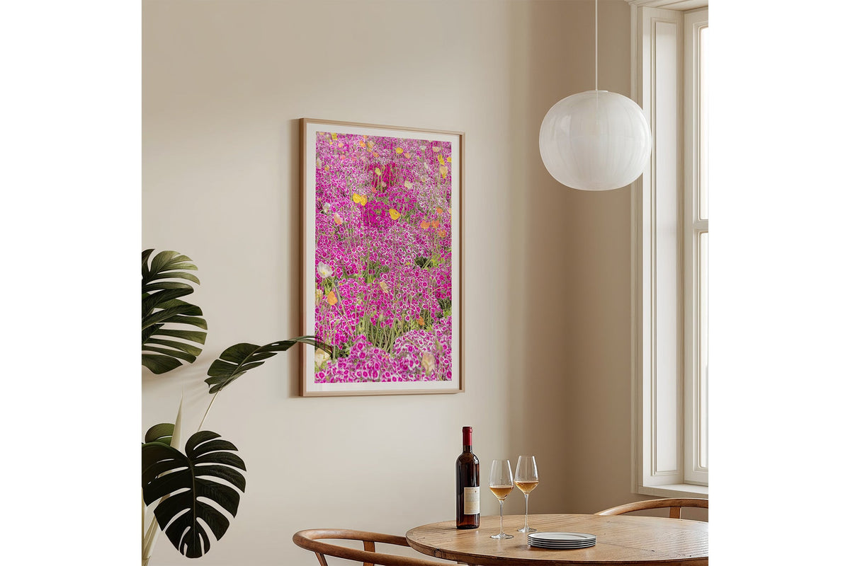 Sweet William carpet print shown framed in oak on a wall.