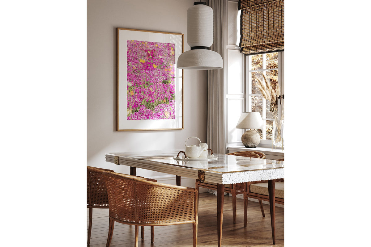 Sweet William carpet print shown framed in oak above a dining table.