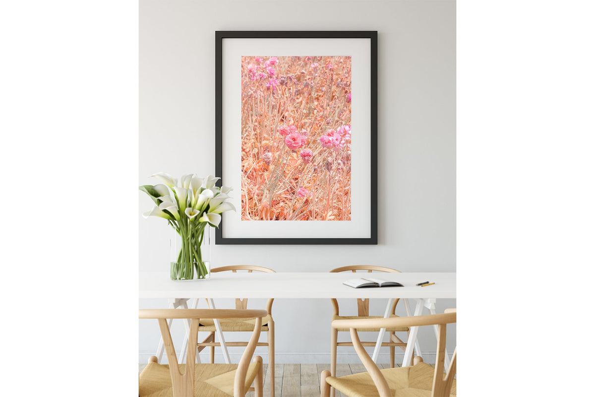 Faded ranunculus print shown framed in black.
