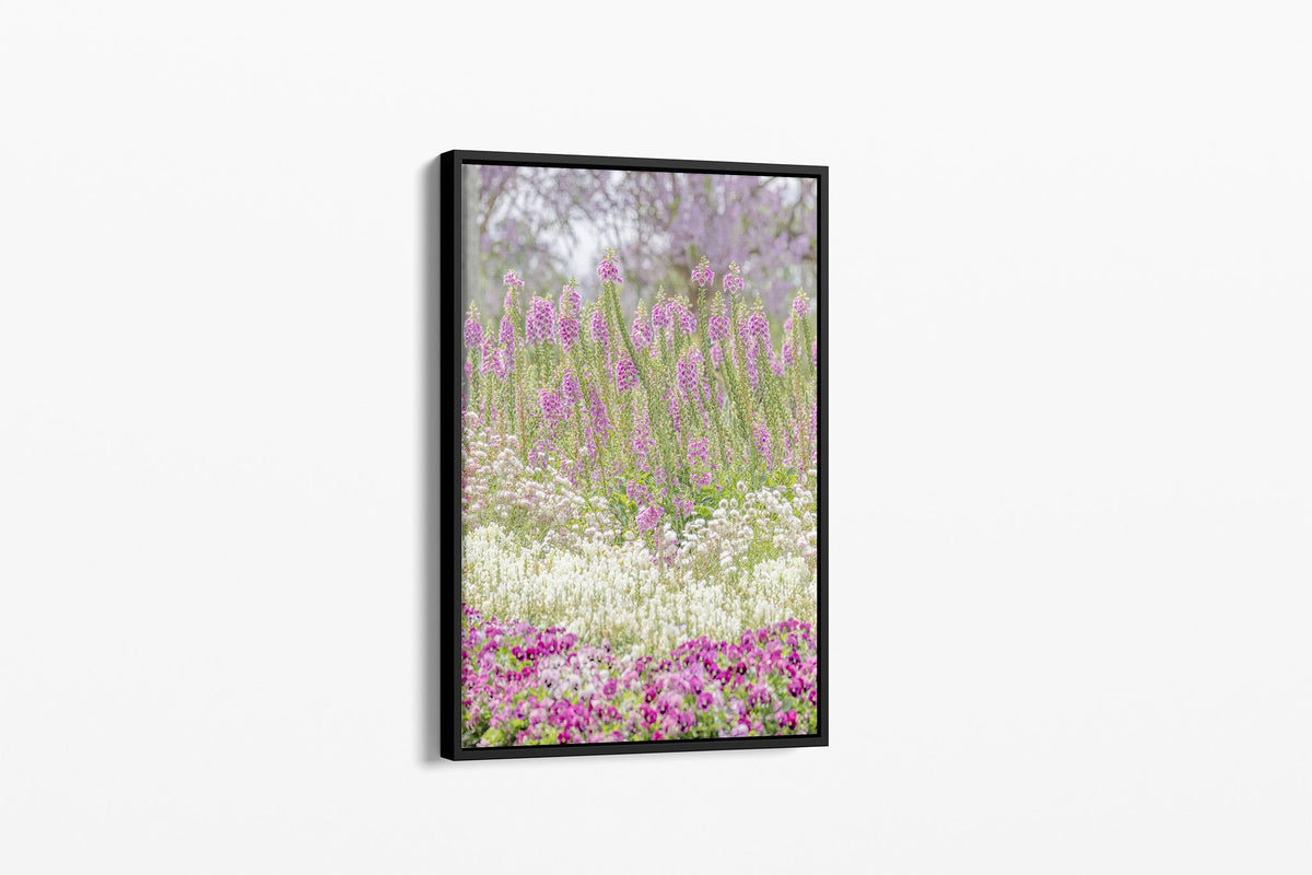 Foxglove garden layers print shown as a canvas in a black float frame.