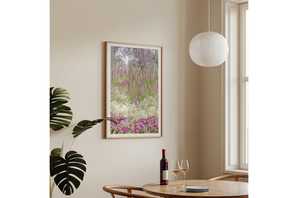 Foxglove garden layers print shown framed in oak on a wall.