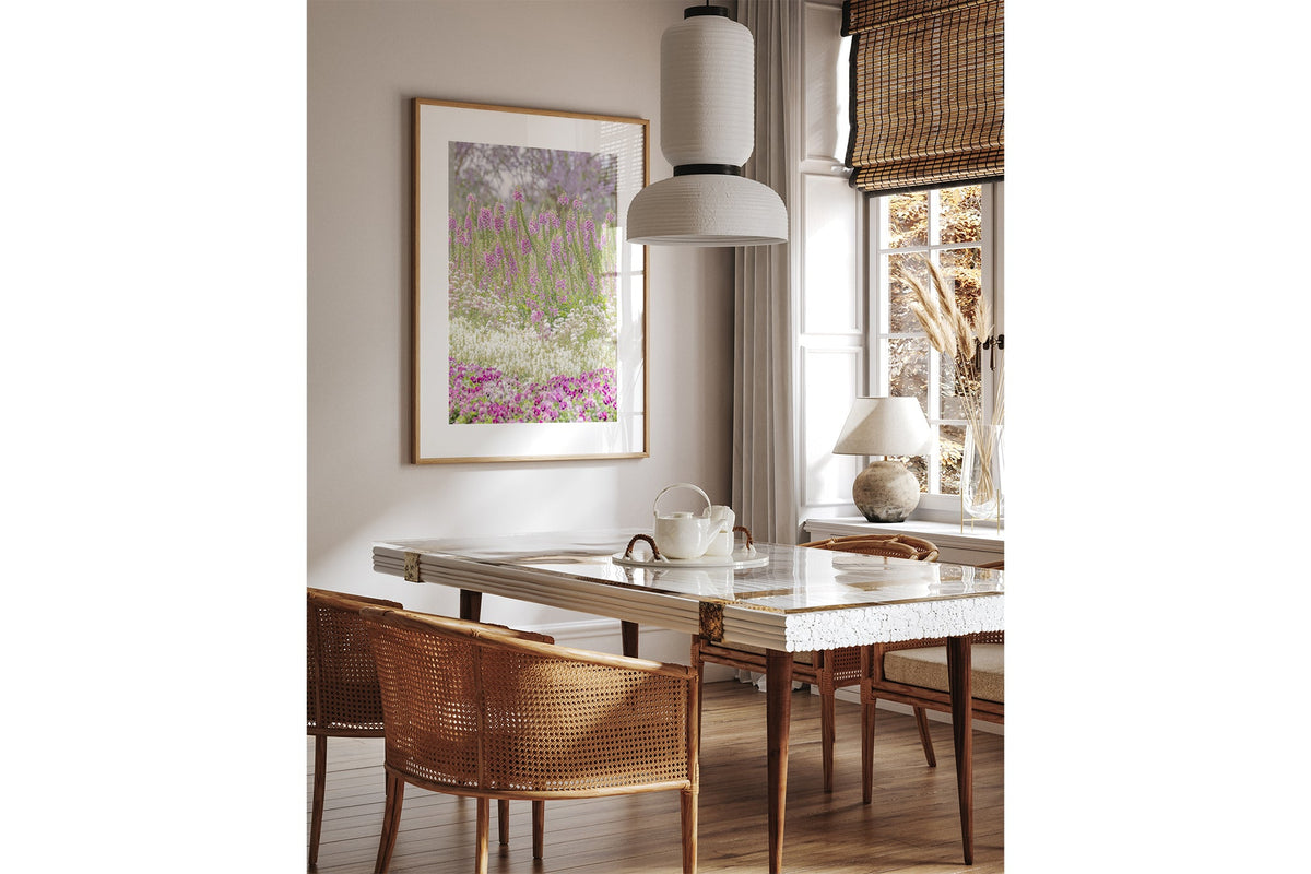 Foxglove garden layers print shown framed in oak above a dining table.