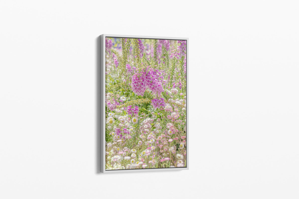 Foxglove meadow print shown as a canvas in a white float frame.