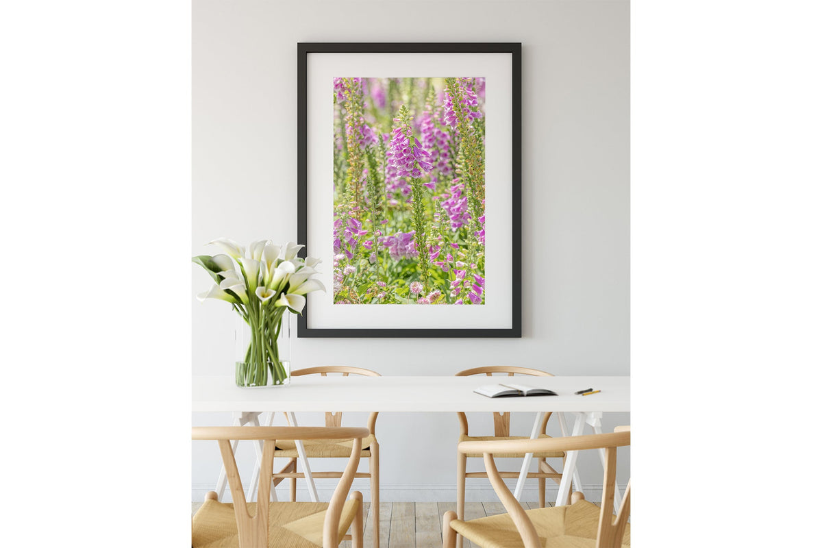 Lilac foxglove print shown framed in black.