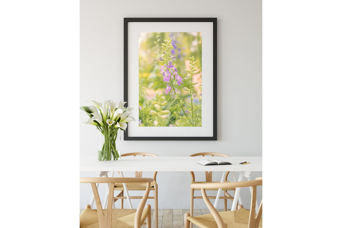 Glowing larkspur print shown framed in black.